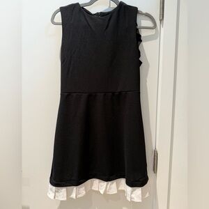 Black Sleeveless Dress with White Ruffle Hem
